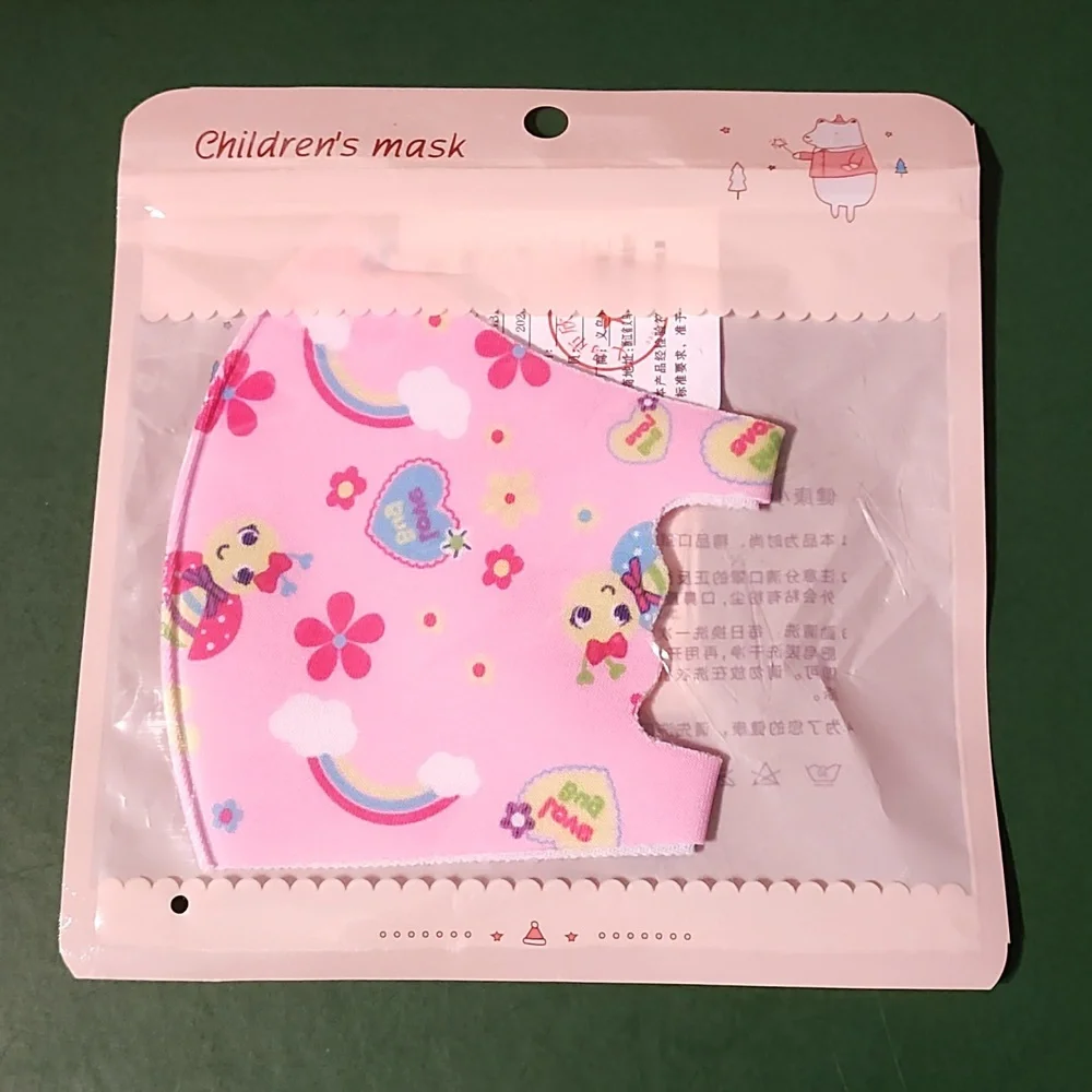 Children's re Usable face mask new in package never opened